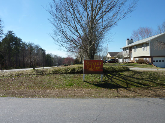 Wooden Entrance sign with Sunset Ridge wording