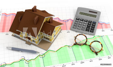 image of house and calculator over graph paper