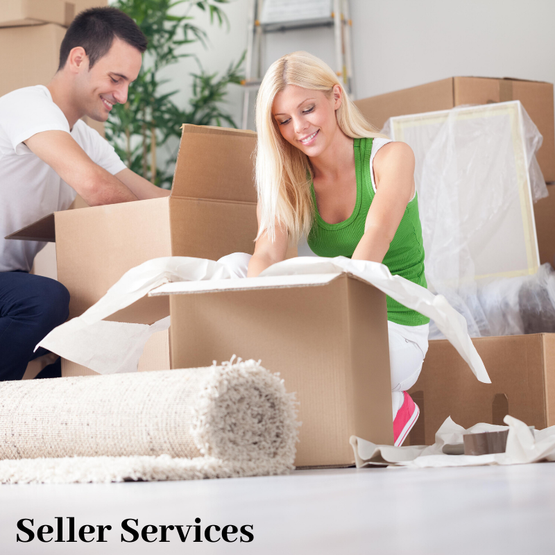 couple packing boxes sign says seller services