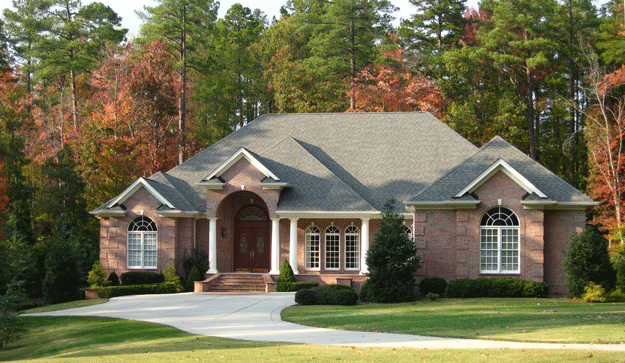 Brick home on large lot with trees