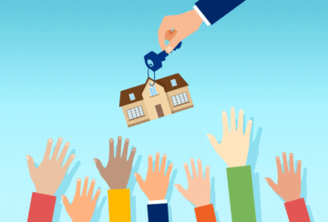 Blue sky background hands raised in air with home and house key dangling above