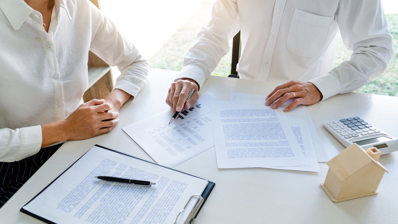 Image of closing on home with seller and buyer