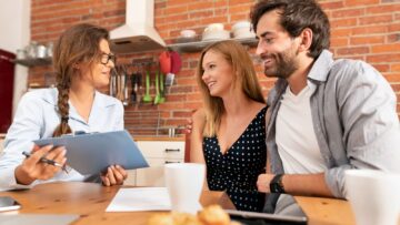 Real Estate Agent Talking to Clients